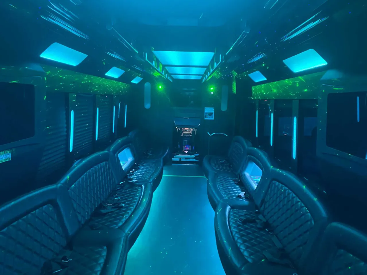 25 Passenger Party Bus interior with perimeter lounge seating, LED accent lighting and LED ceiling lighting, photo 2 for party bus rental in Ozone Park, NY 25 Passenger Party Bus interior with perimeter lounge seating, LED accent lighting and LED ceiling lighting, photo 2 for party bus rental in Ozone Park, NY