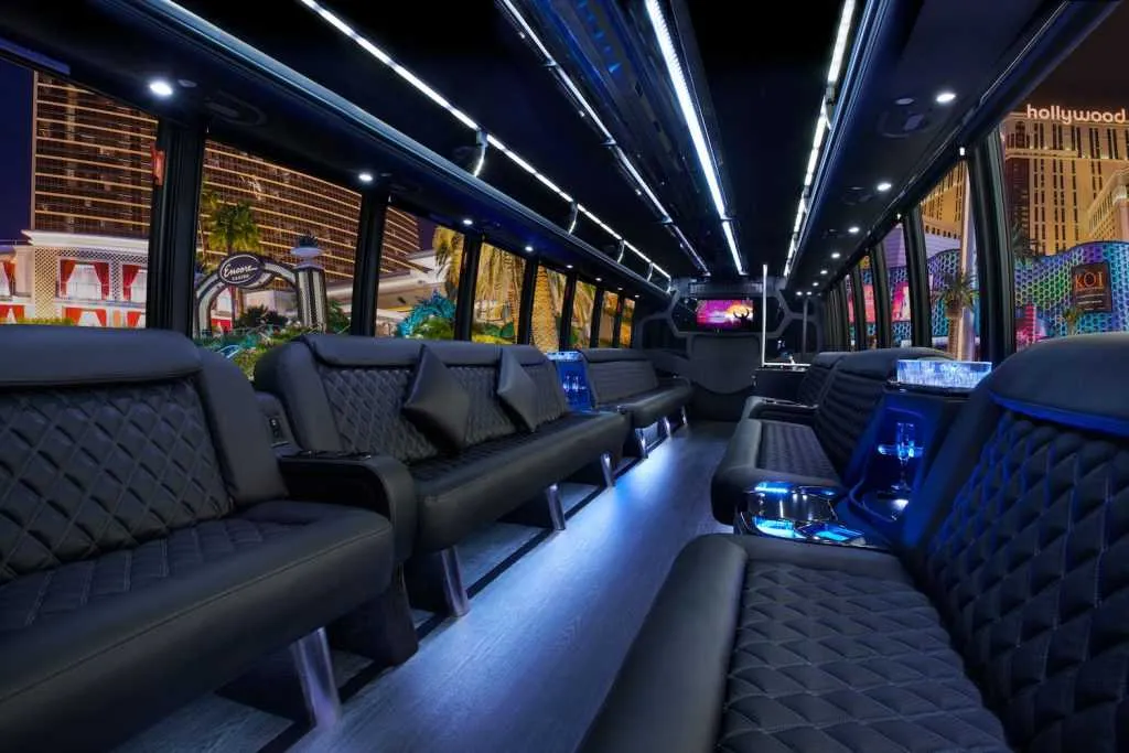 30 Passenger Party Bus 30 Passenger Party Bus interior with perimeter lounge seating, LED accent lighting and LED ceiling lighting for party bus rental
