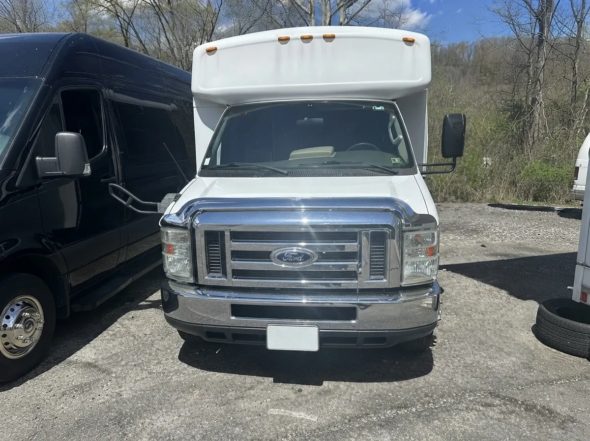 White-painted 18 Passenger Party Bus ready for booking