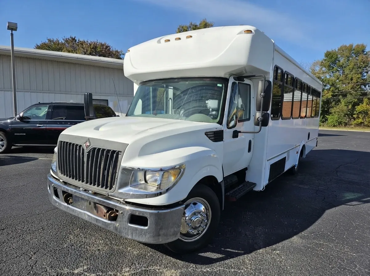 White-painted 18 Passenger Party Bus ready for booking