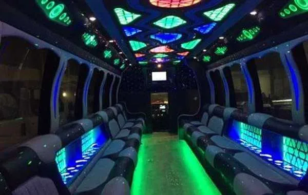 Party Bus Black Party Bus Black, inside view, perimeter lounge seating, LED accent lighting and LED ceiling lighting