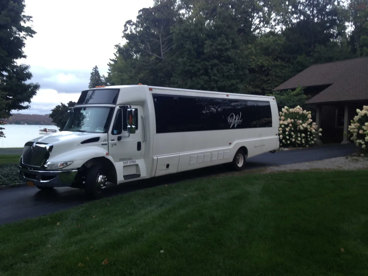 White Party Bus - Dean Martin with tinted windows for party bus rental in Monroe County, NY