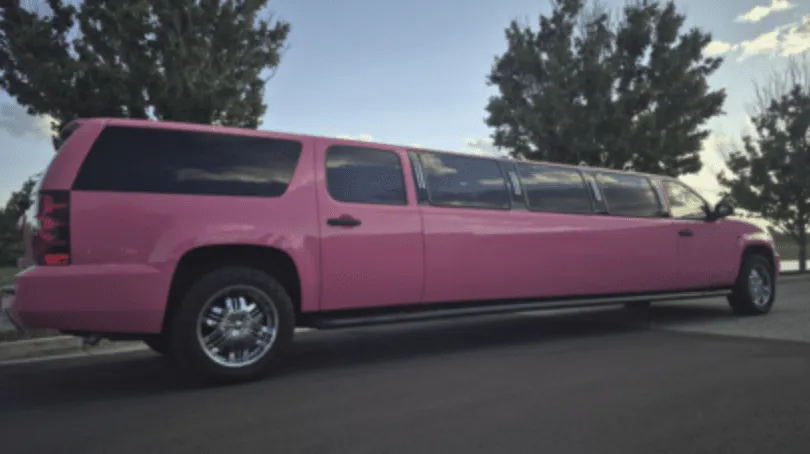 Pink Chevrolet Suburban Limousine with tinted windows for limo rental in Dillon County, SC