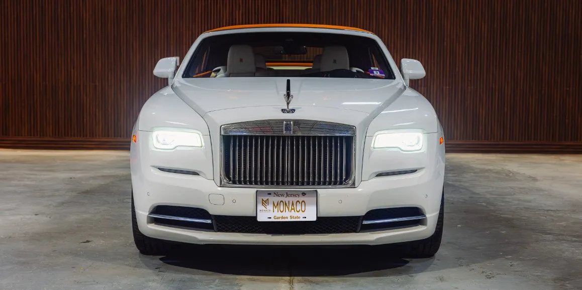 White Rolls Royce Dawn (Hermes) exterior with convertible roof for wedding car rental in Currituck County, NC