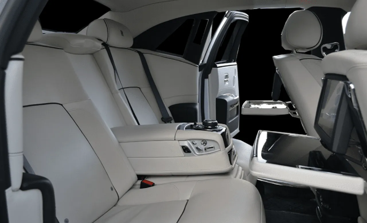 Rolls Royce Ghost interior with rear-seat entertainment screens for wedding car rental in Calhoun County, SC