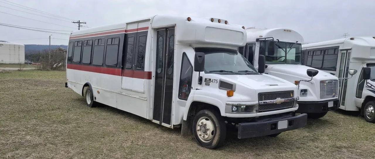 The Red Line Party Bus White-painted The Red Line Party Bus ready for booking